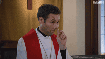 A priest poking their nose then pointing at someone