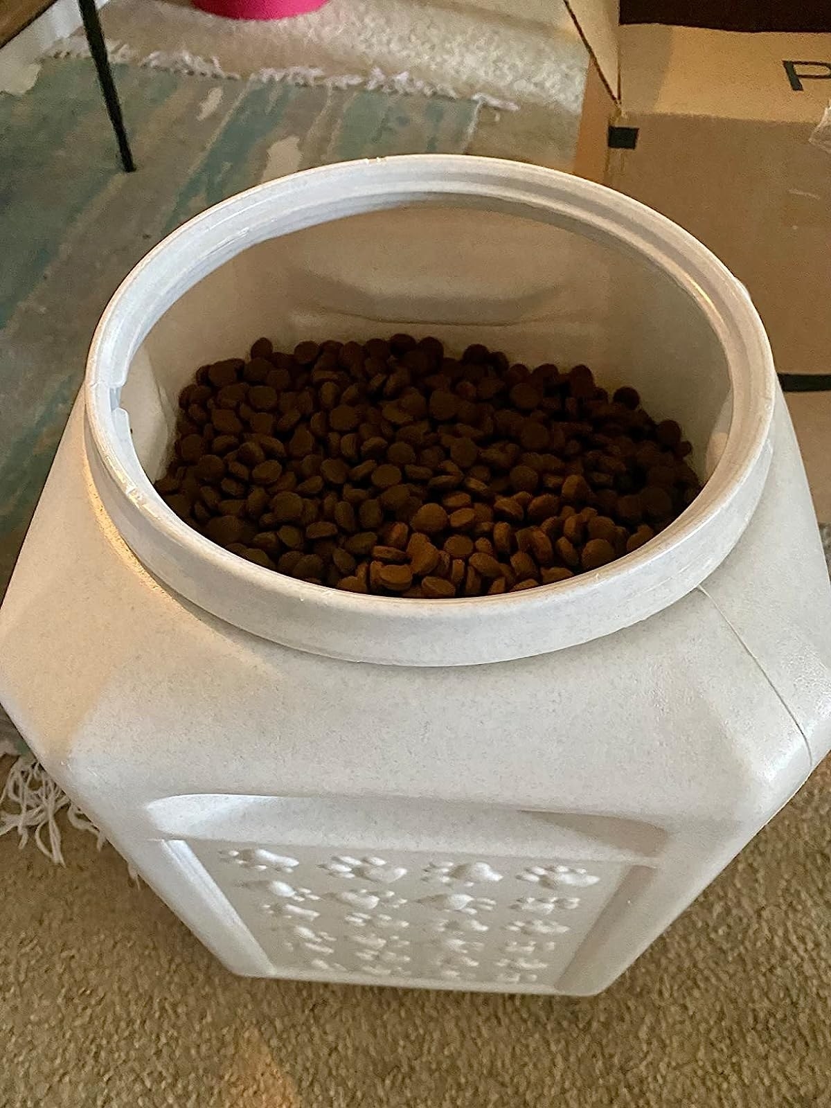 a reviewer&#x27;s photo of the pet food in the container