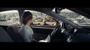 Emma Stone flustered in city traffic in La La Land