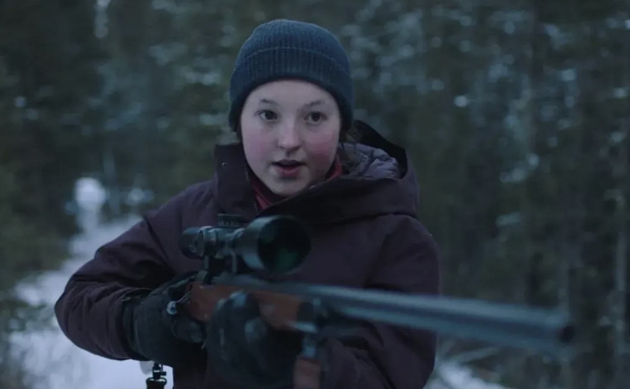 Bella as Ellie in &quot;The Last of Us,&quot; holding a gun