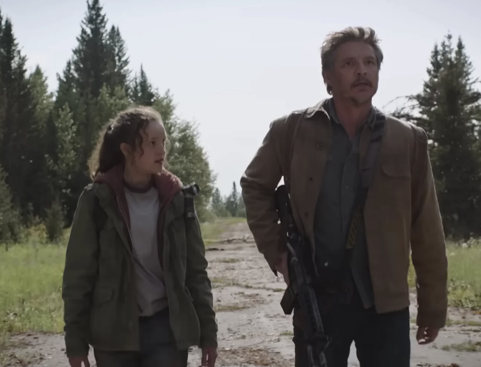 Bella and Pedro Pascal in &quot;The Last of Us&quot; walking along a road