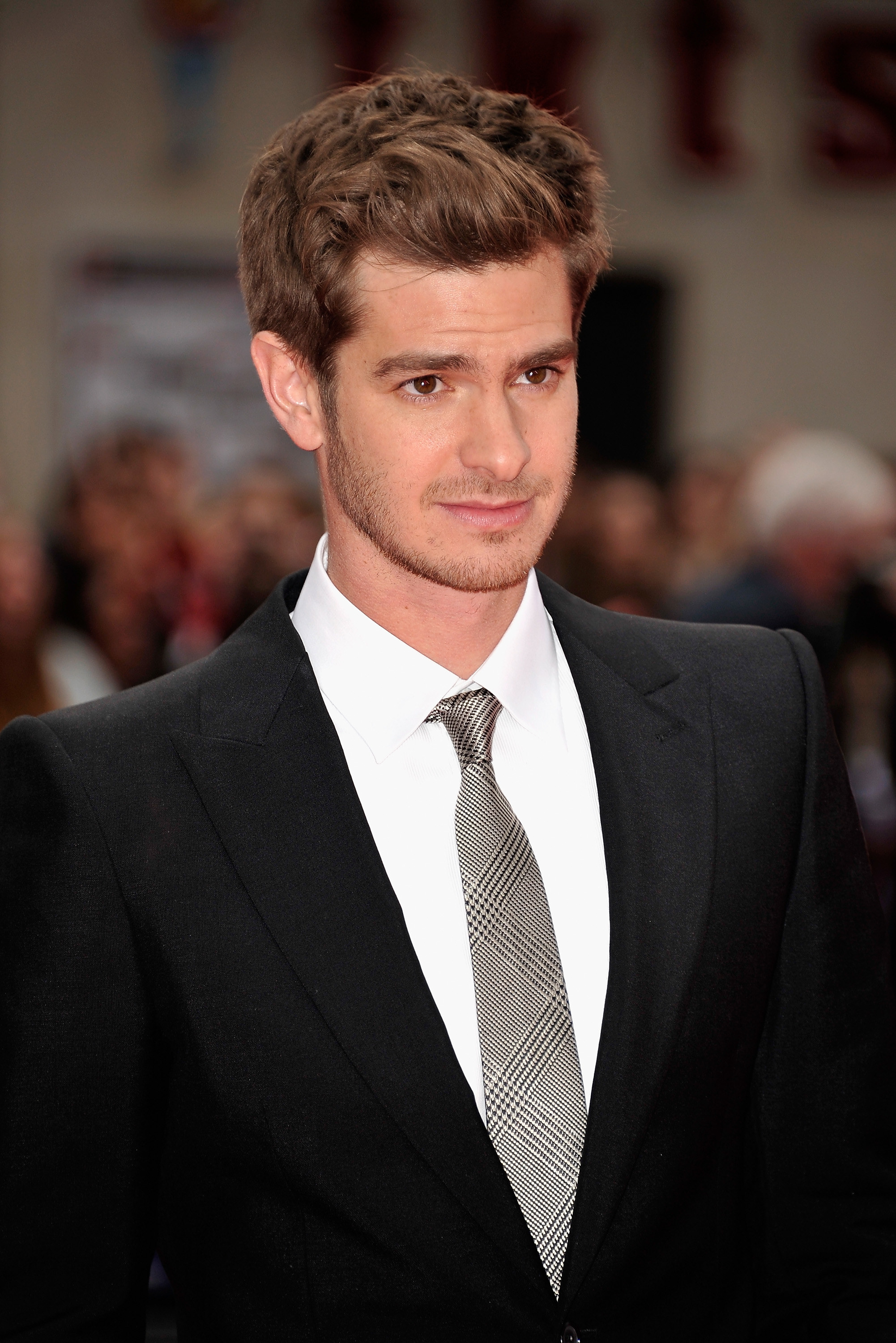 Close-up of Andrew in a suit and tie