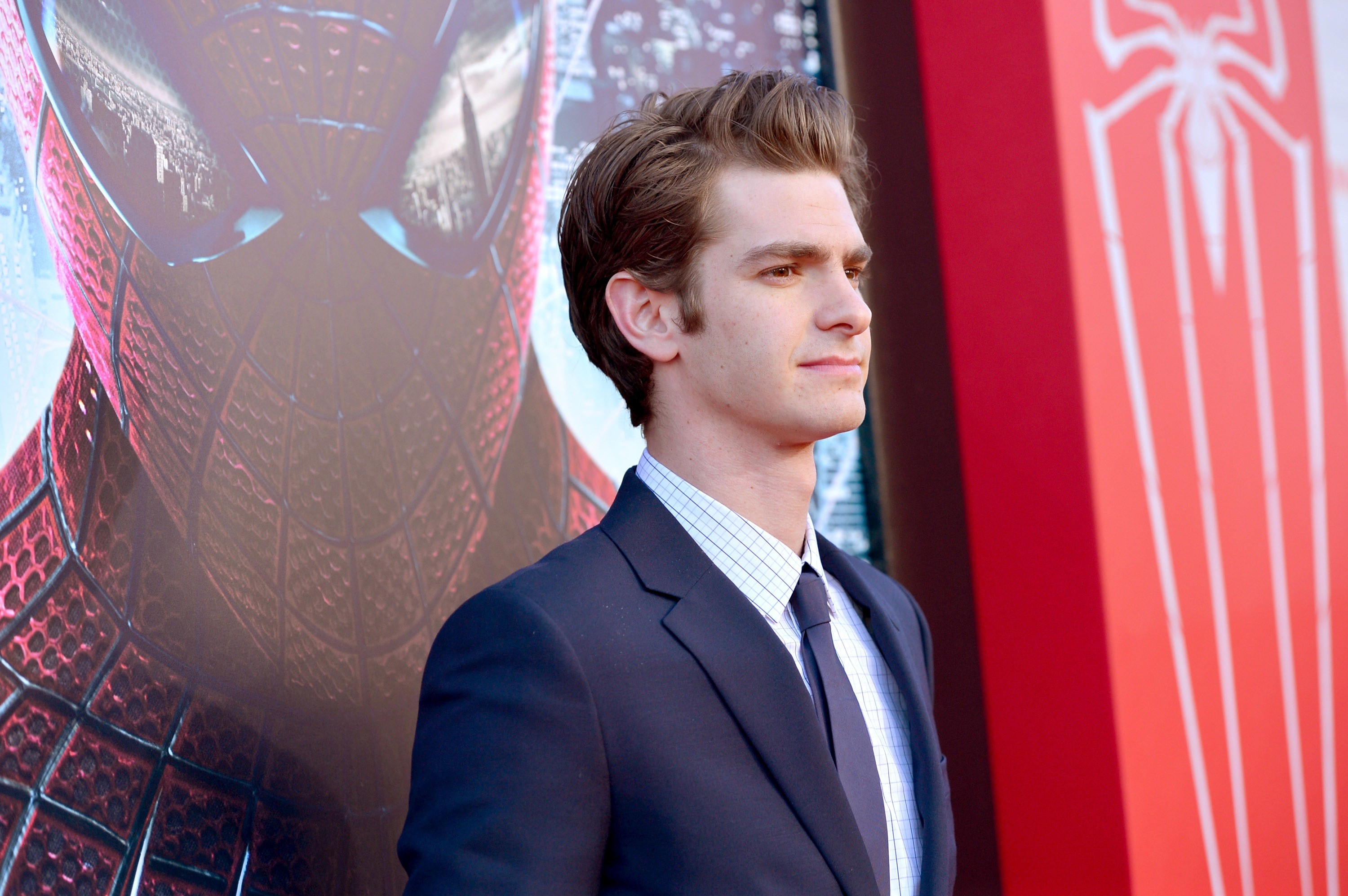Close-up of Andrew in a suit and tie