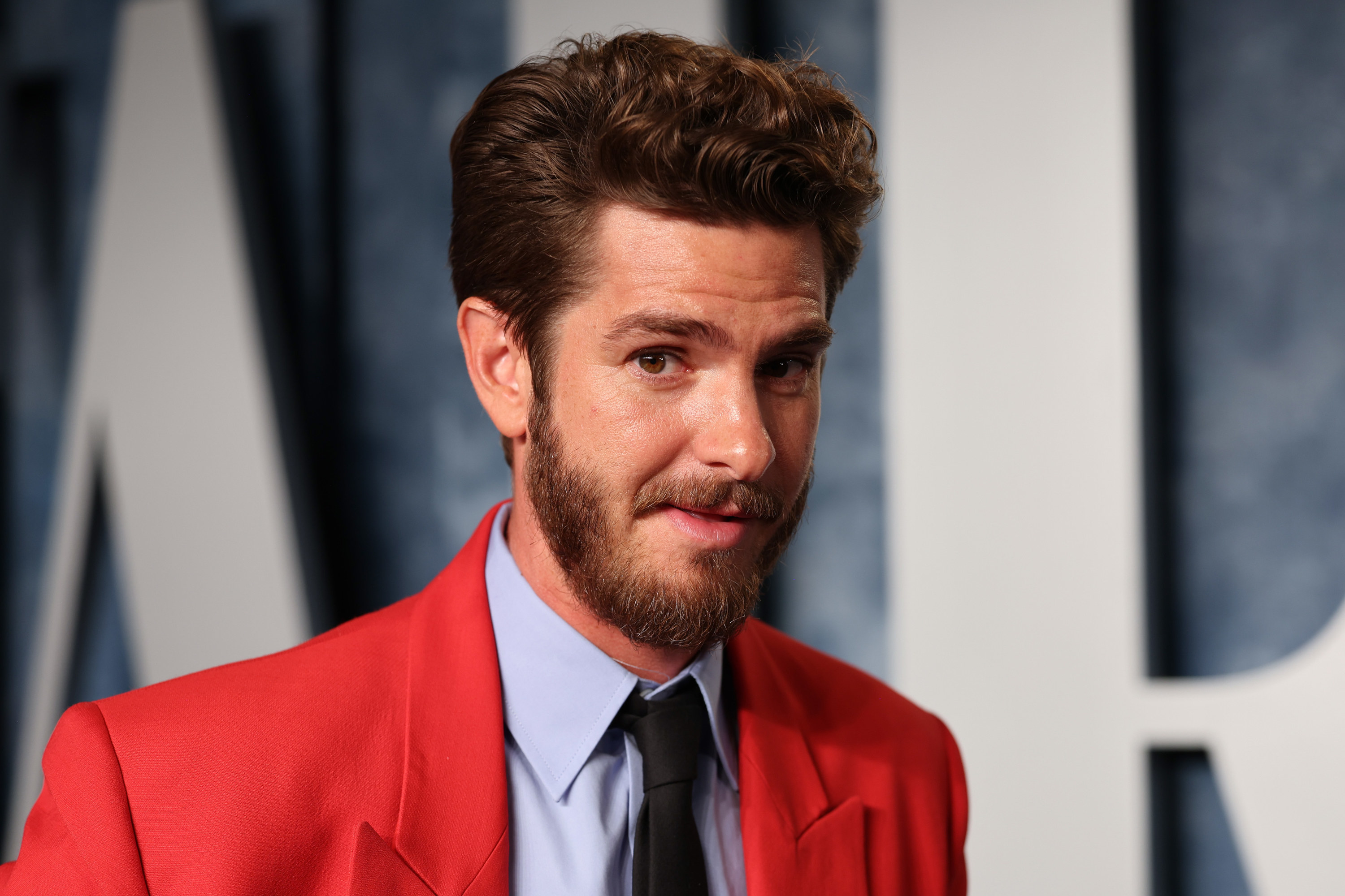 Close-up of Andrew in a suit and tie