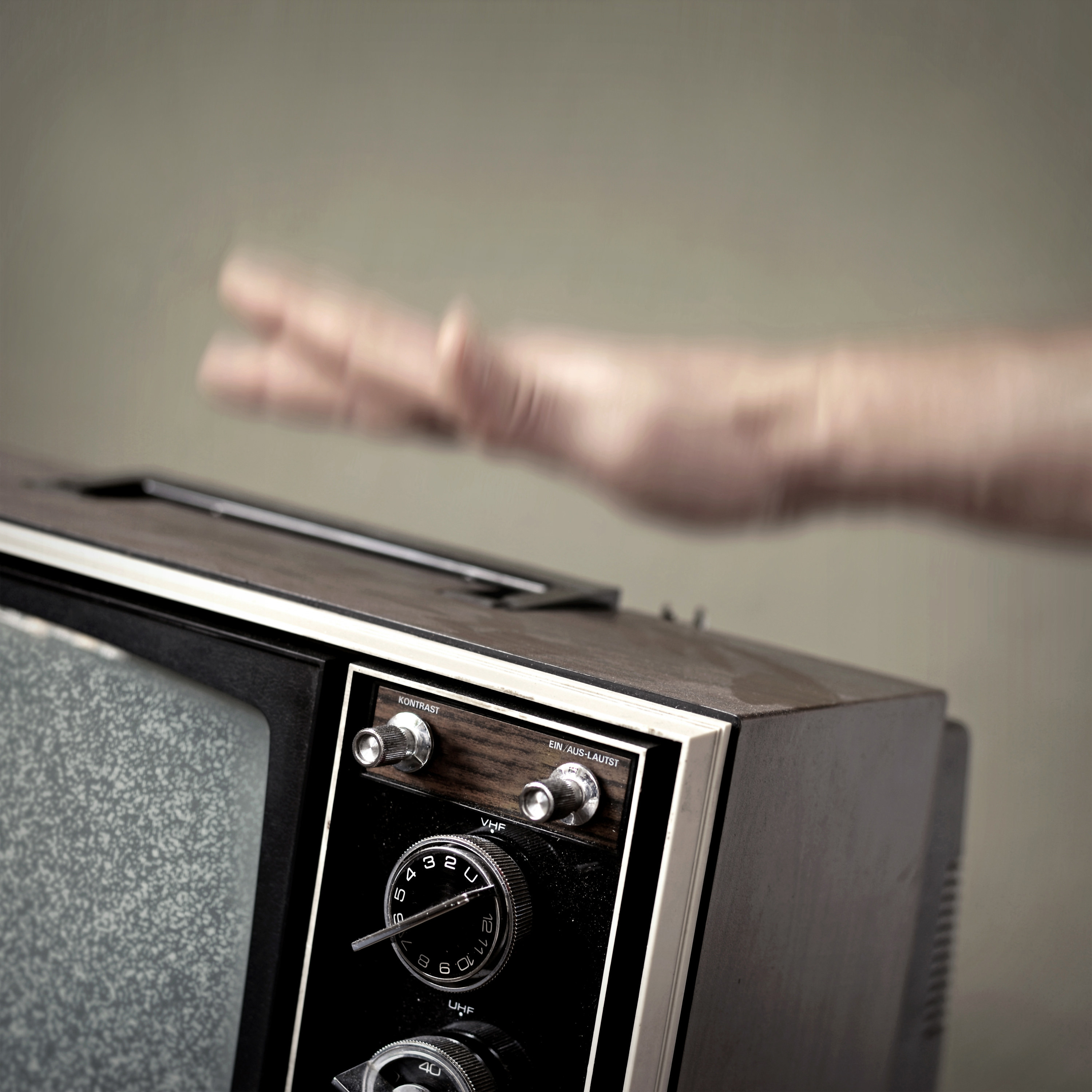 a person hitting a tv