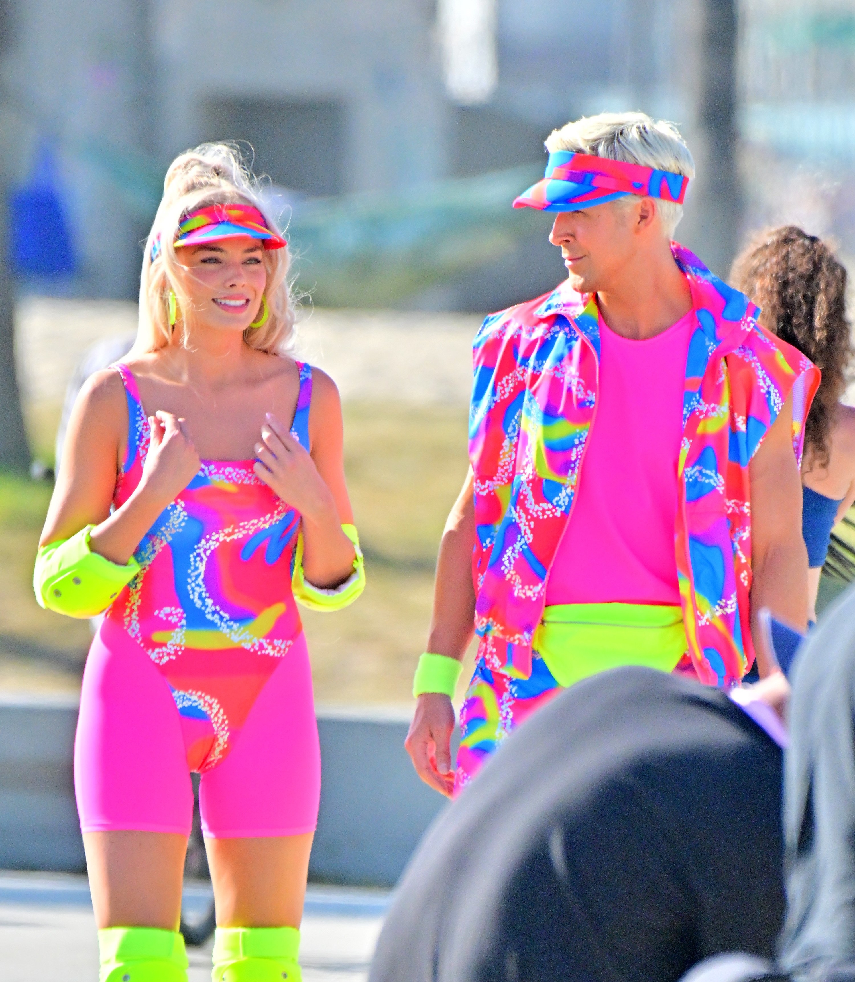 Close-up of Margot and Ryan roller-skating and Ryan looking at her