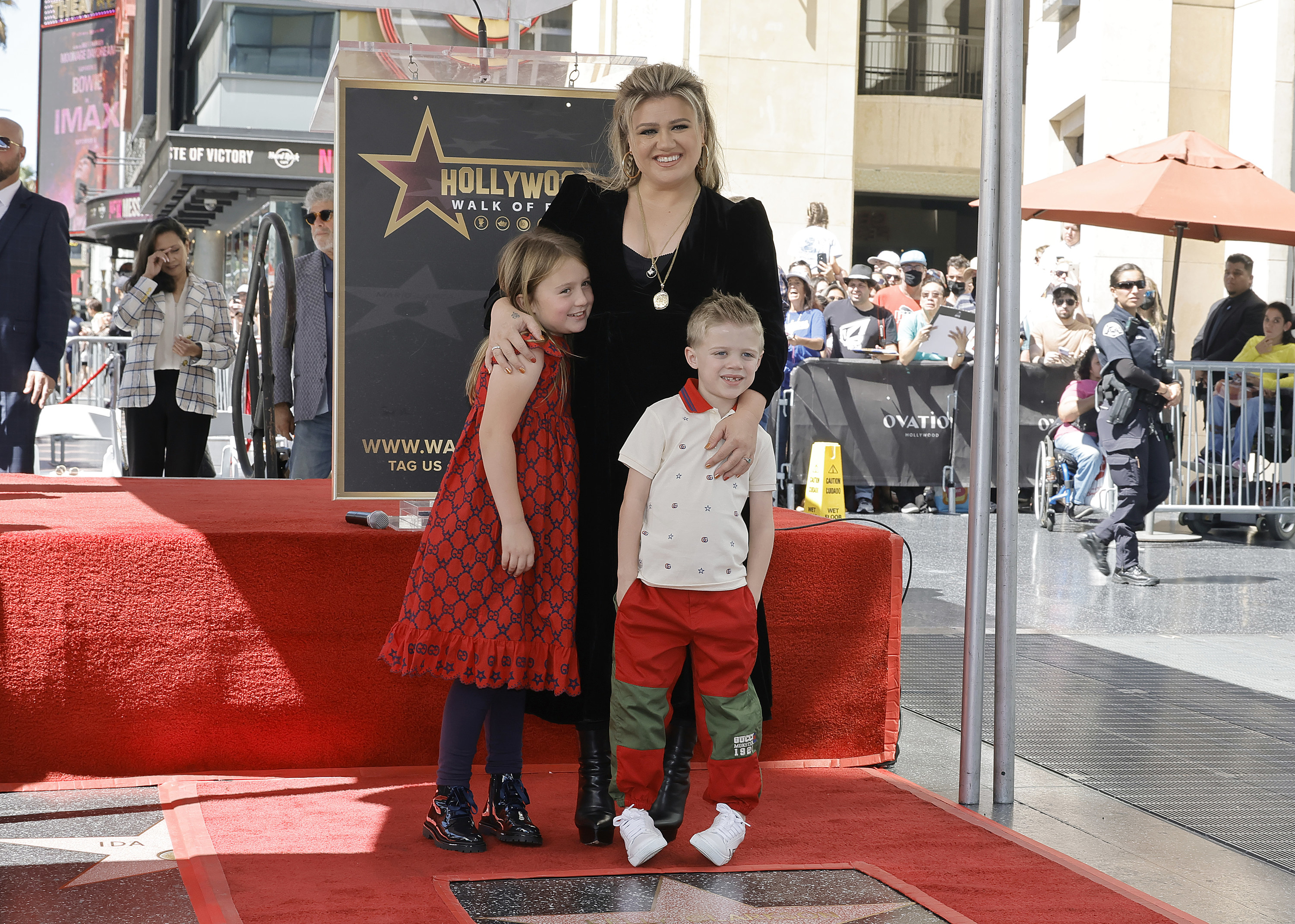 Kelly stands with her kids at her Hollywood Walk of Fame ceremony