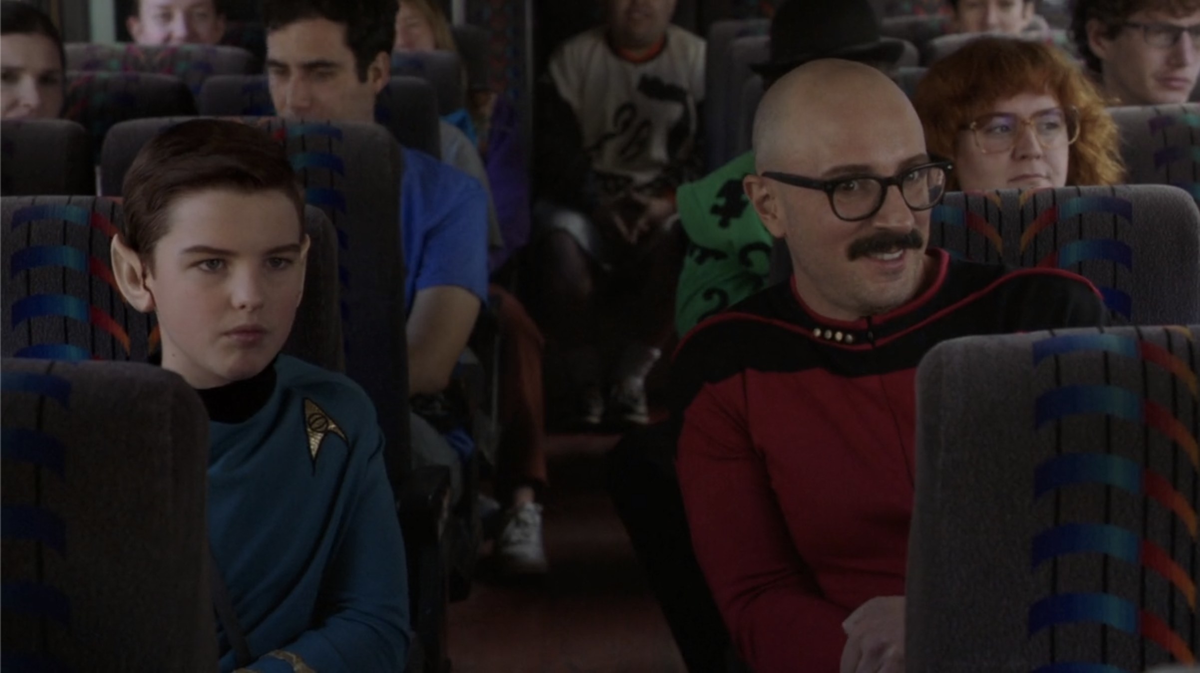 iain armitage and steve burns on a bus dressed as star trek characters on young sheldon