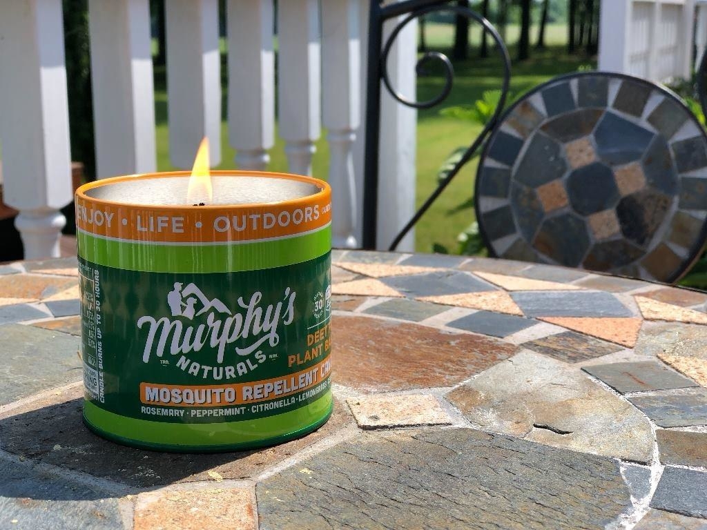 Reviewer image of the candle on their outdoor table
