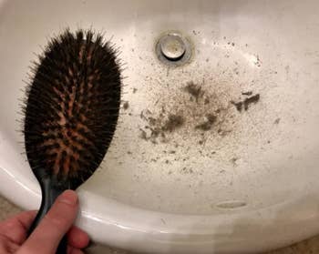a reviewer's brush while being cleaned and a bunch of stuff that came out in the sink