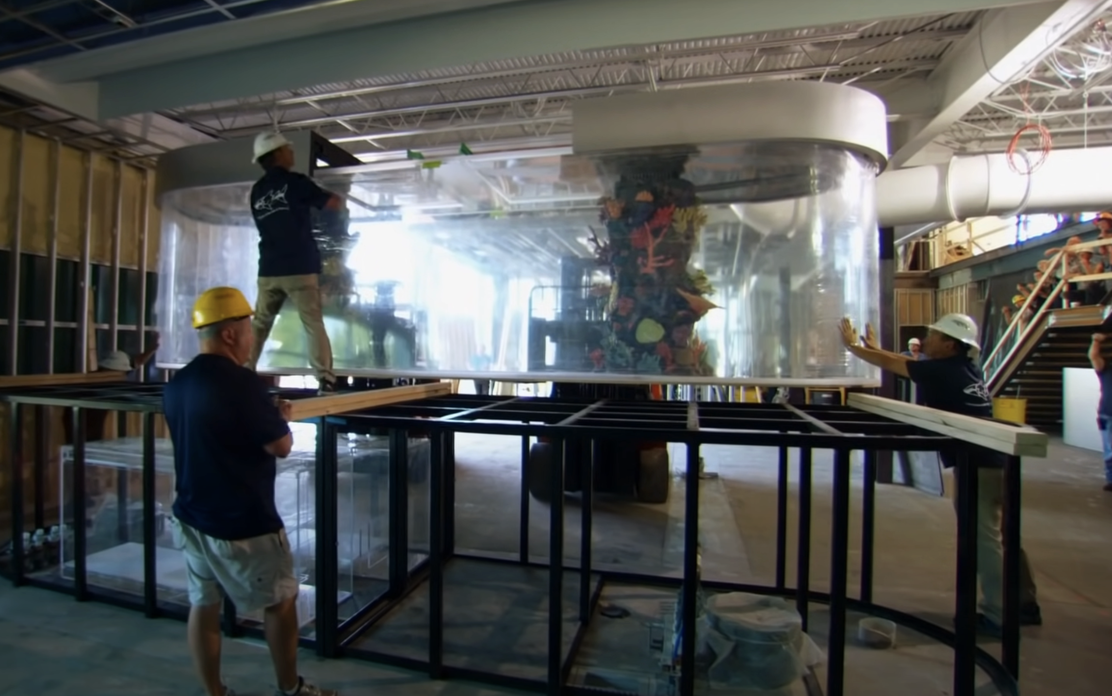 people building out a large tank