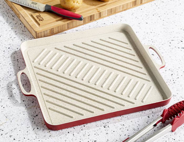 red and cream square grill pan with side handles