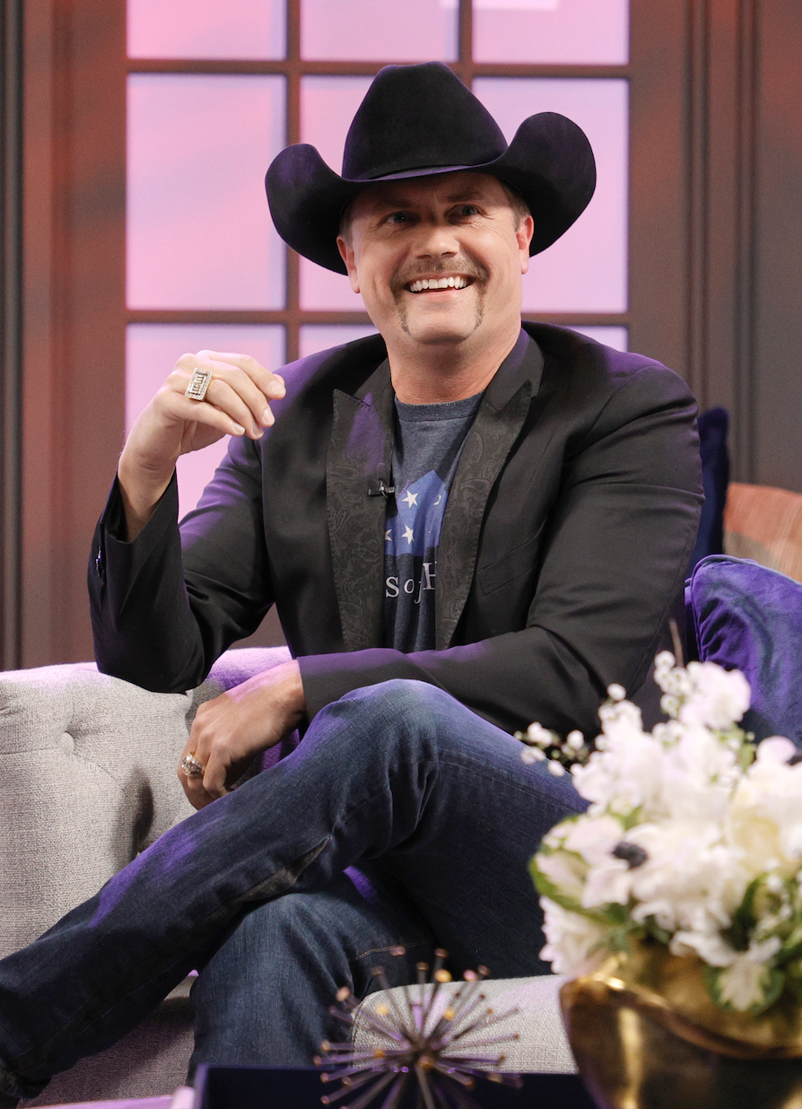 John Rich sitting and smiling