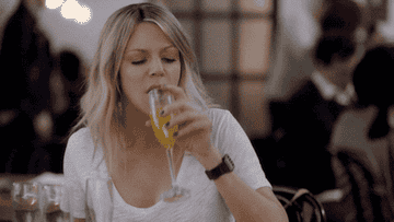 Mickey chugging a mimosa in "The Mick"