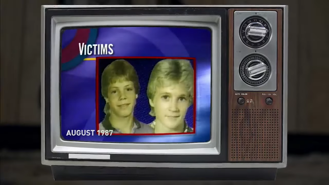 A TV showing a news report about Kevin Ives and Don Henry