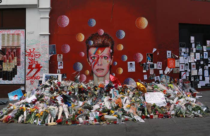flowers and letters left to david bowie&#x27;s memory at a shrine