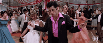 Olivia Newton-John and John Travolta dancing in Grease