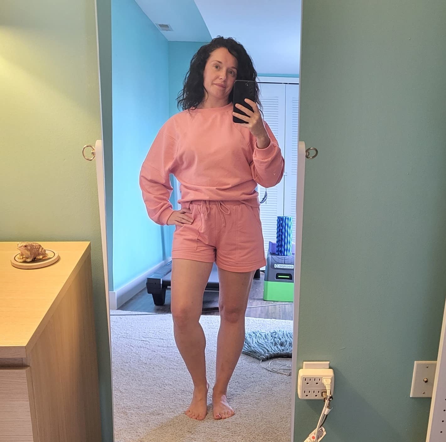 reviewer wearing the lounge set in pink