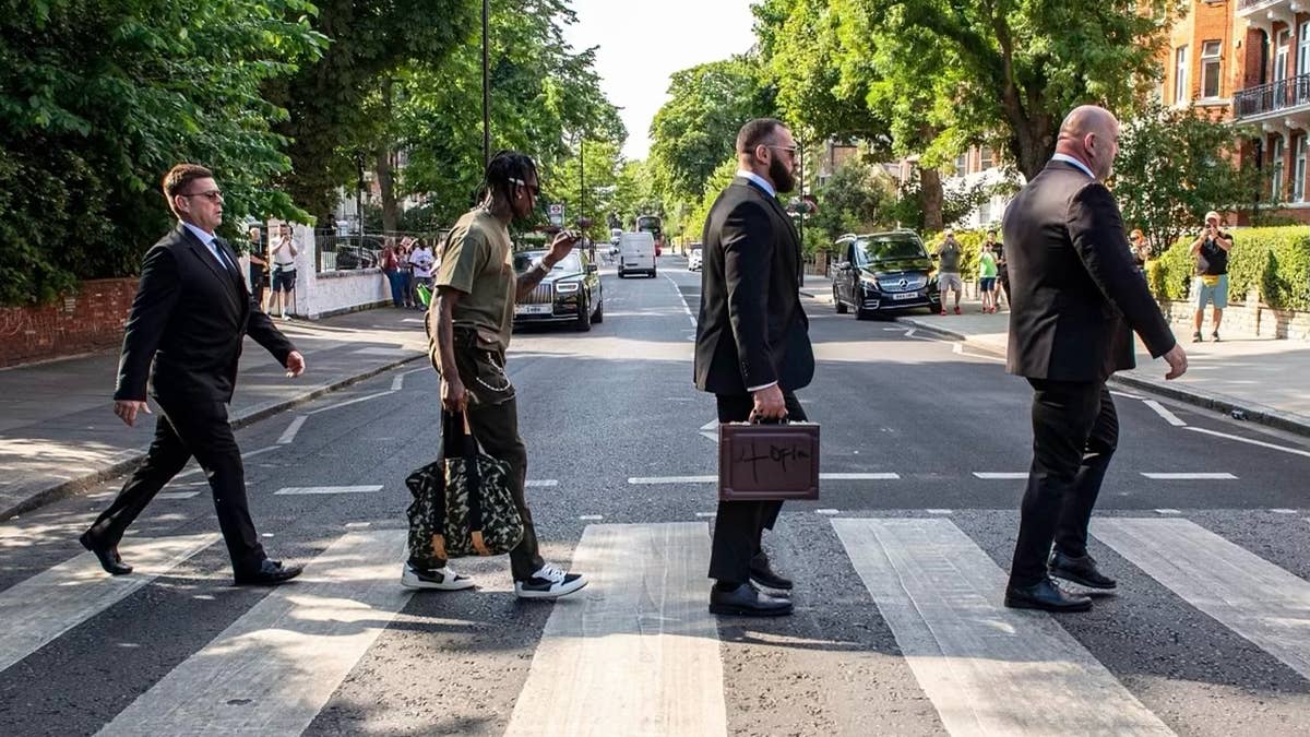 Anticipation for 'Utopia' continues to build, with Scott being spotted paying homage to the Beatles with his infamous labeled briefcase in tow.