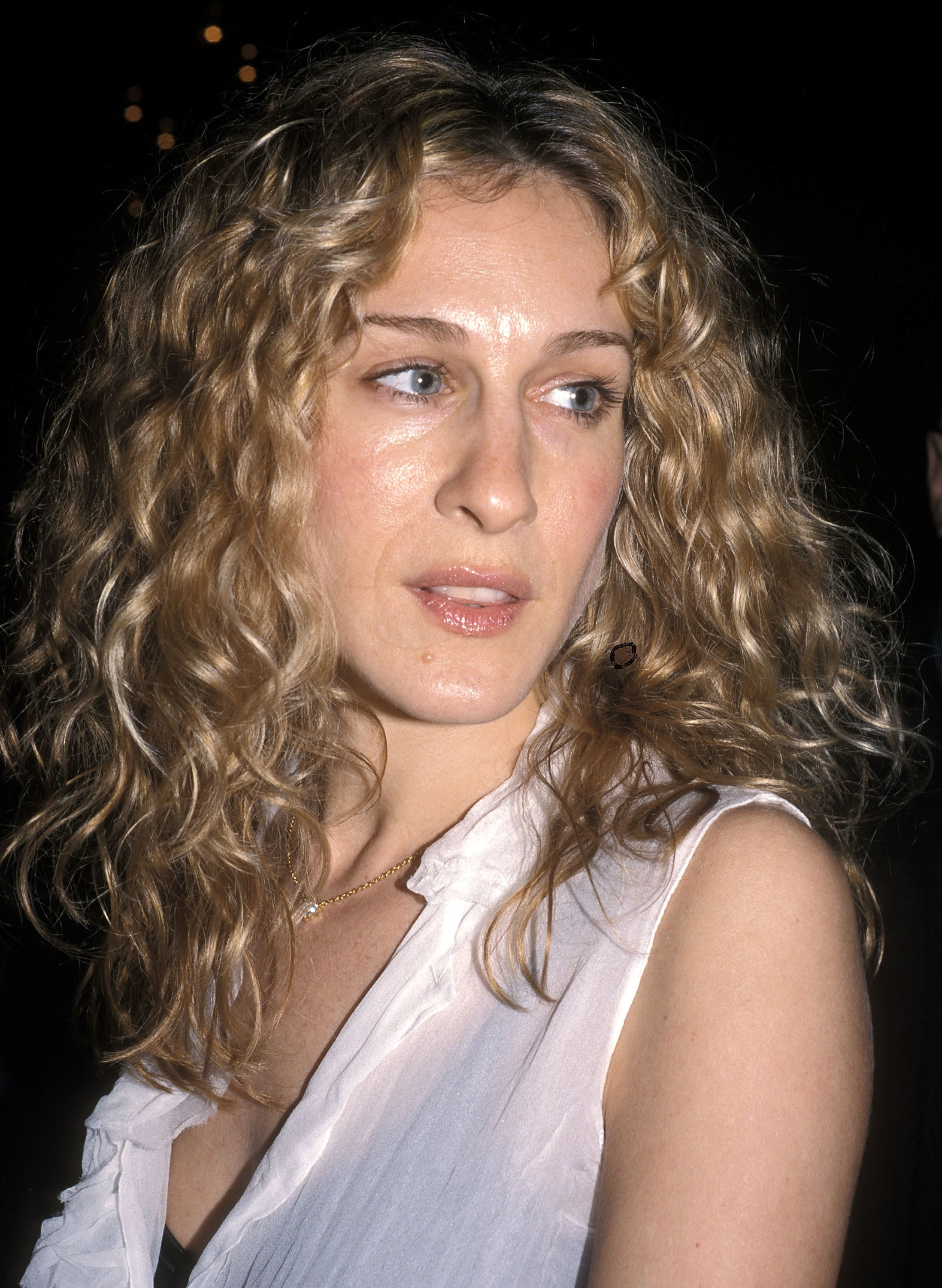 Close-up of SJP looking to the side