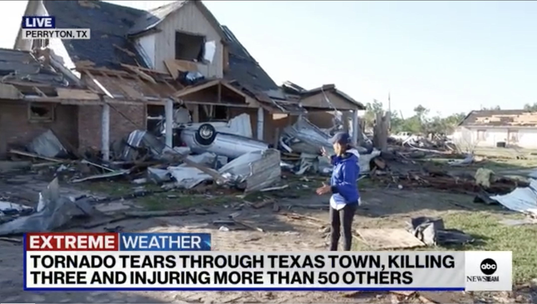 Scene of very damaged house with an upside down vehicle and other debris in front of it, with chyron &quot;Extreme weather: Tornado tears through Texas town, killing three and injuring more than 50 others&quot;