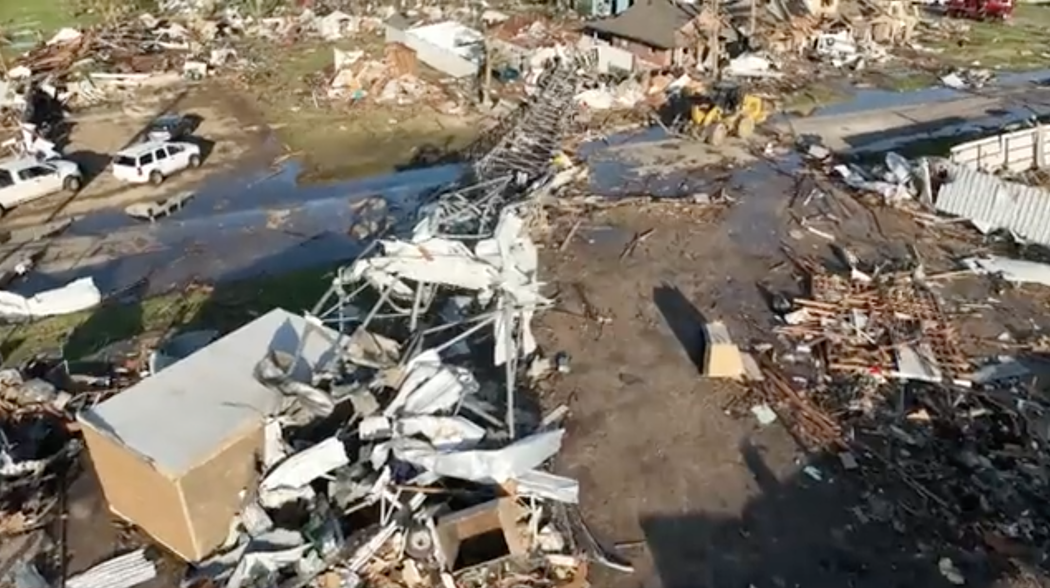 Overhead of destruction and downed power line tower
