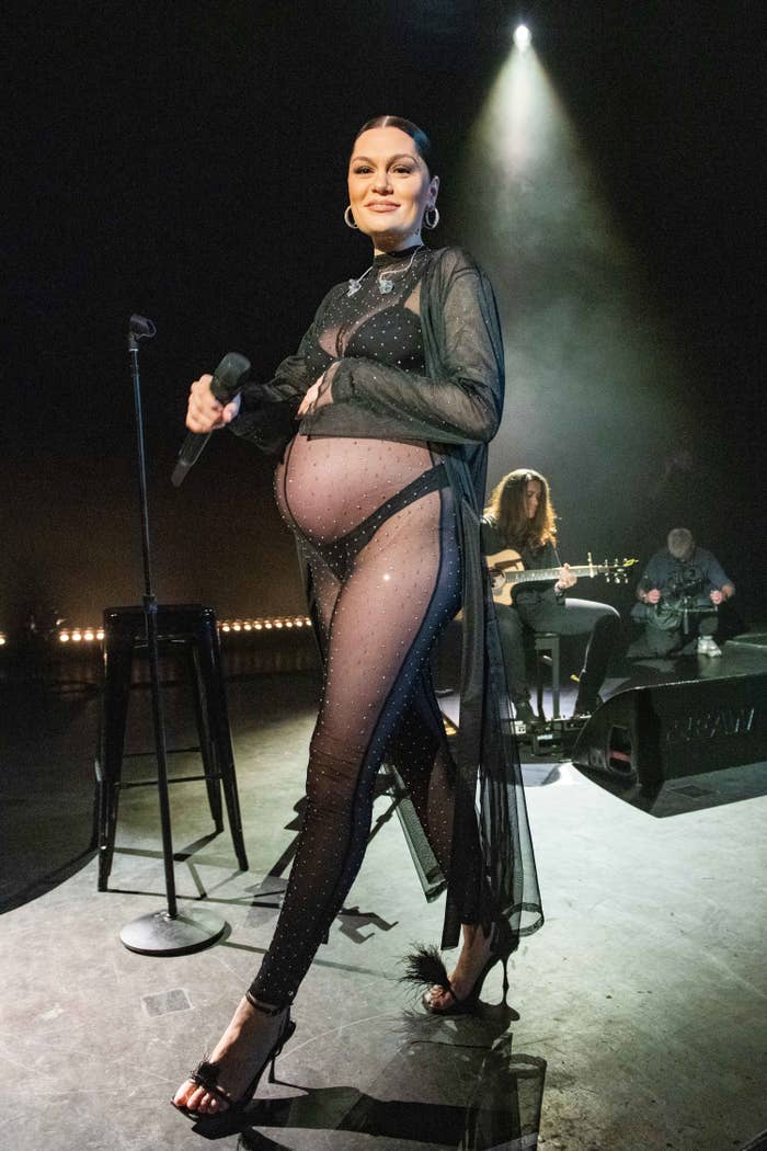 A pregnant Jessie onstage in a diaphanous bra-and-panties outfit and stiletto sandals