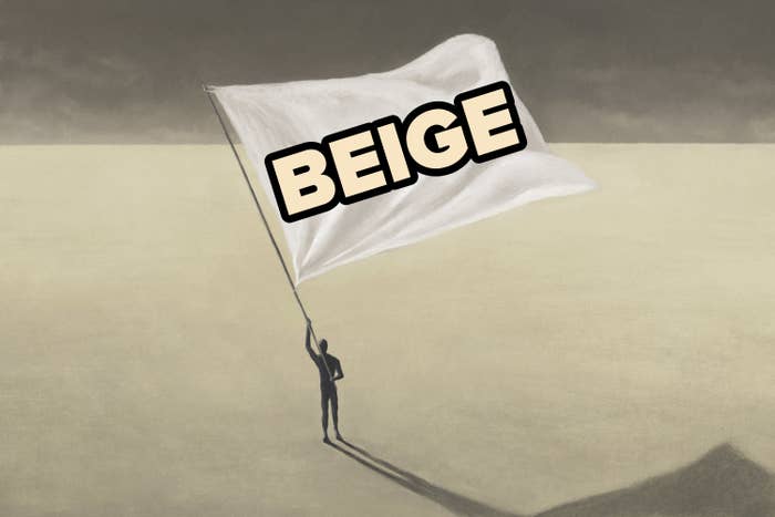 An silhouette of a person holding a beige flag