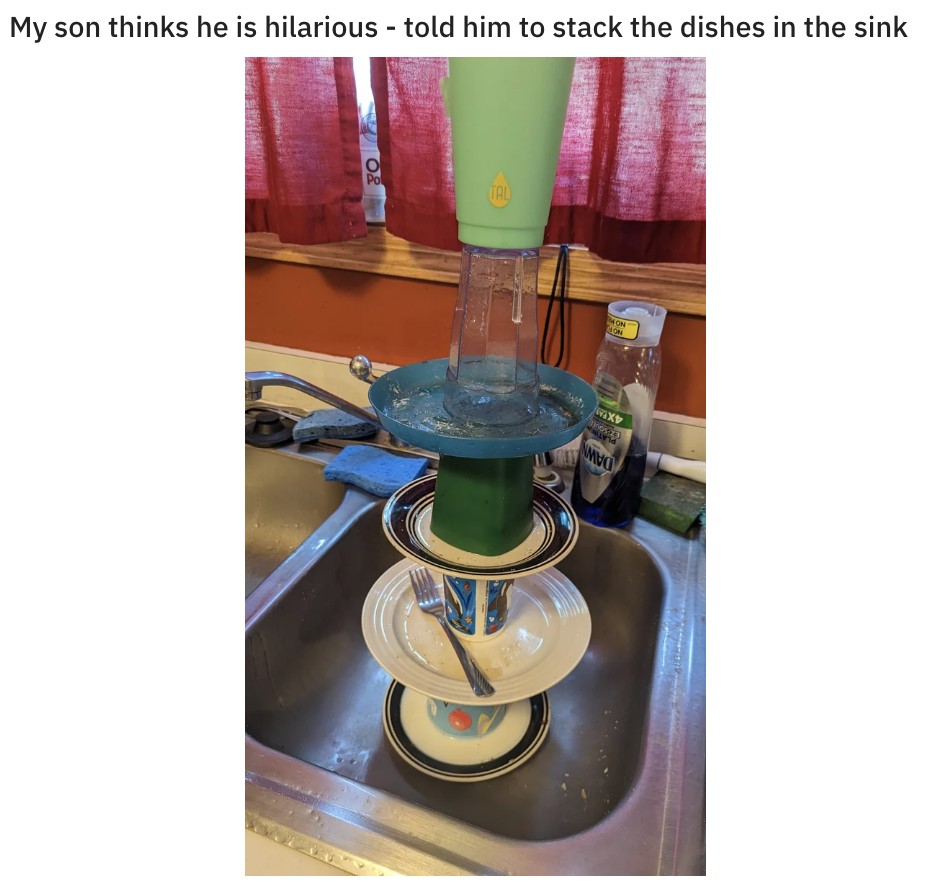 cups and plates stacked on top of each to make a tower in the sink