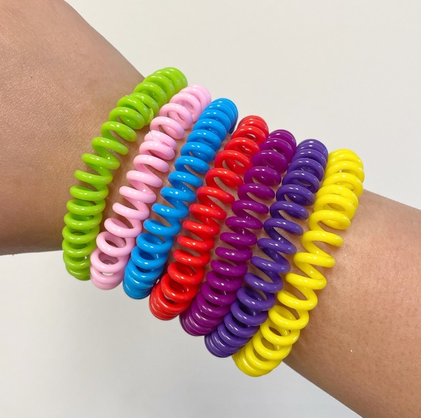 Seven of the bracelets on an arm