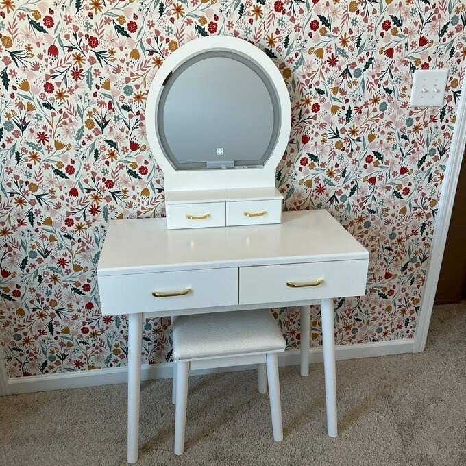a reviewer photo of the white vanity and stool