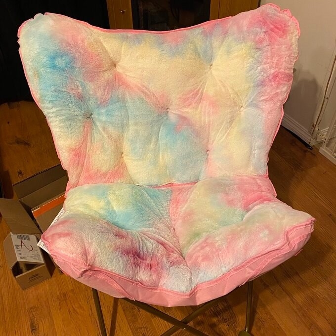 a reviewer photo of the multicolored chair
