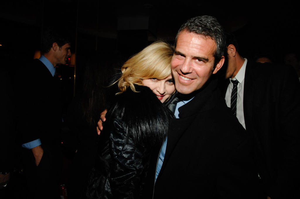 closeup of madonna and andy hugging at an event