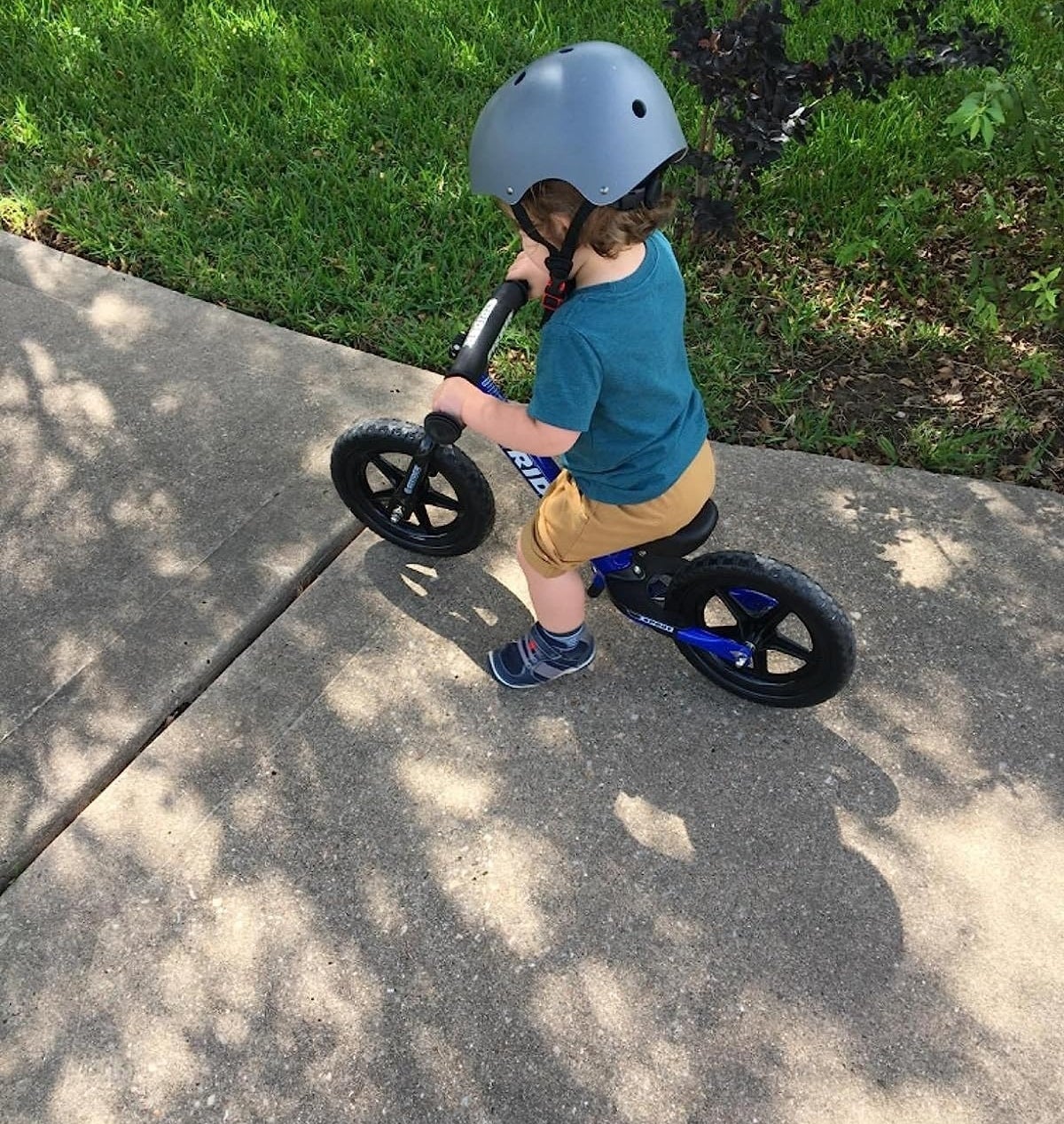 Child rides on a balance bike
