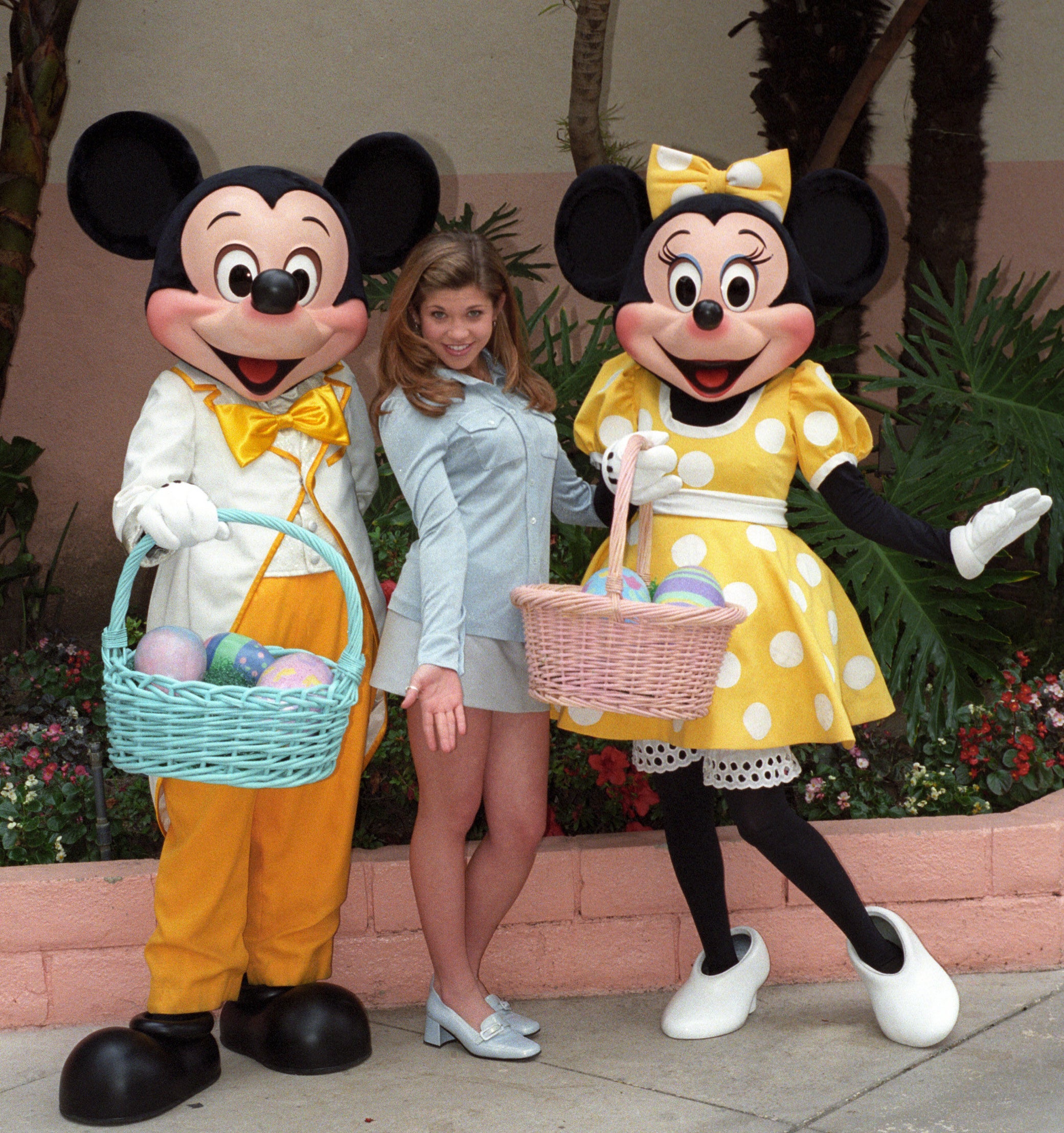 Danielle posing with actors as Mickey and Minnie Mouse