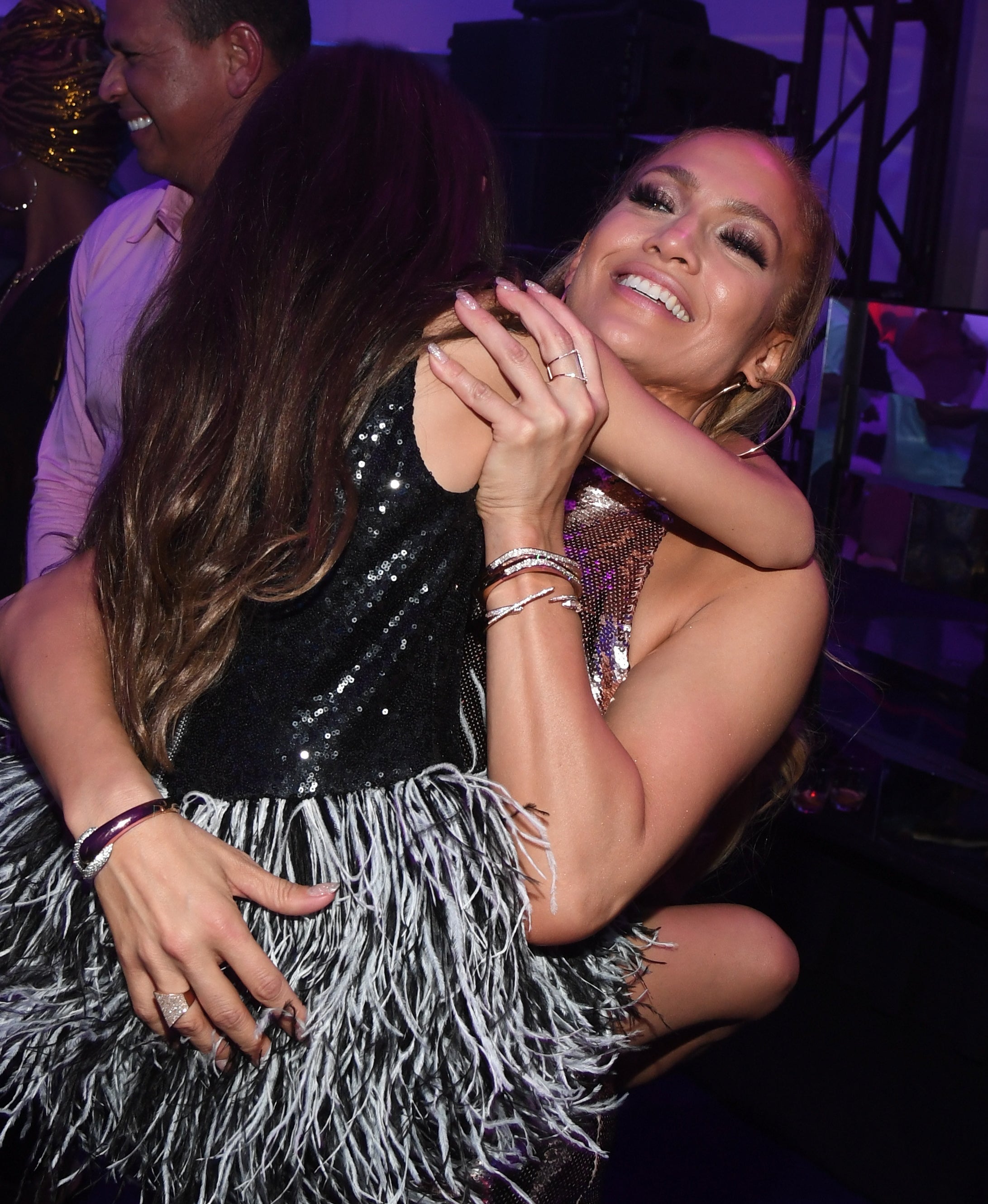 JLo hugging one of her children