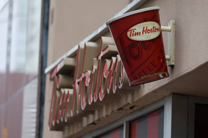 A Tim Hortons sign is pictured outside the restaurant along Yonge St., south of Eglinton Ave., in Toronto.