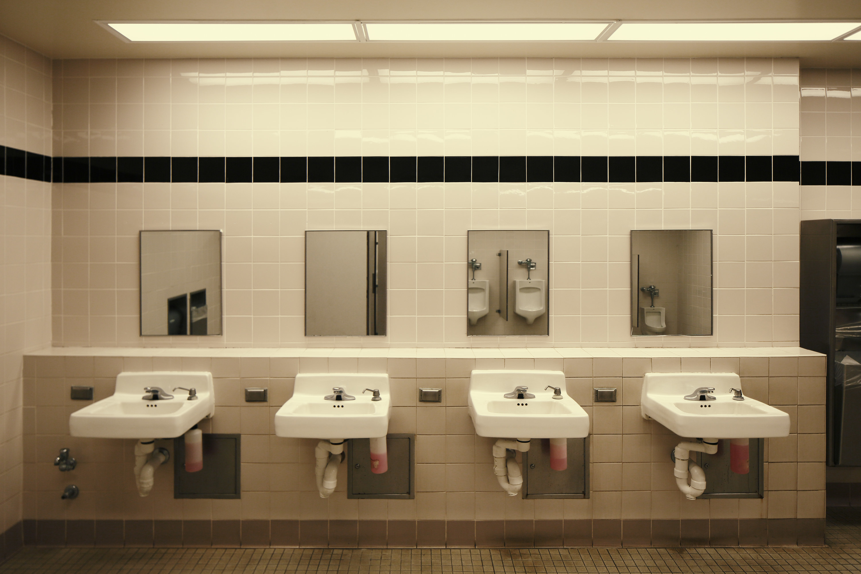 Line of sinks and mirrors in a public bathroom