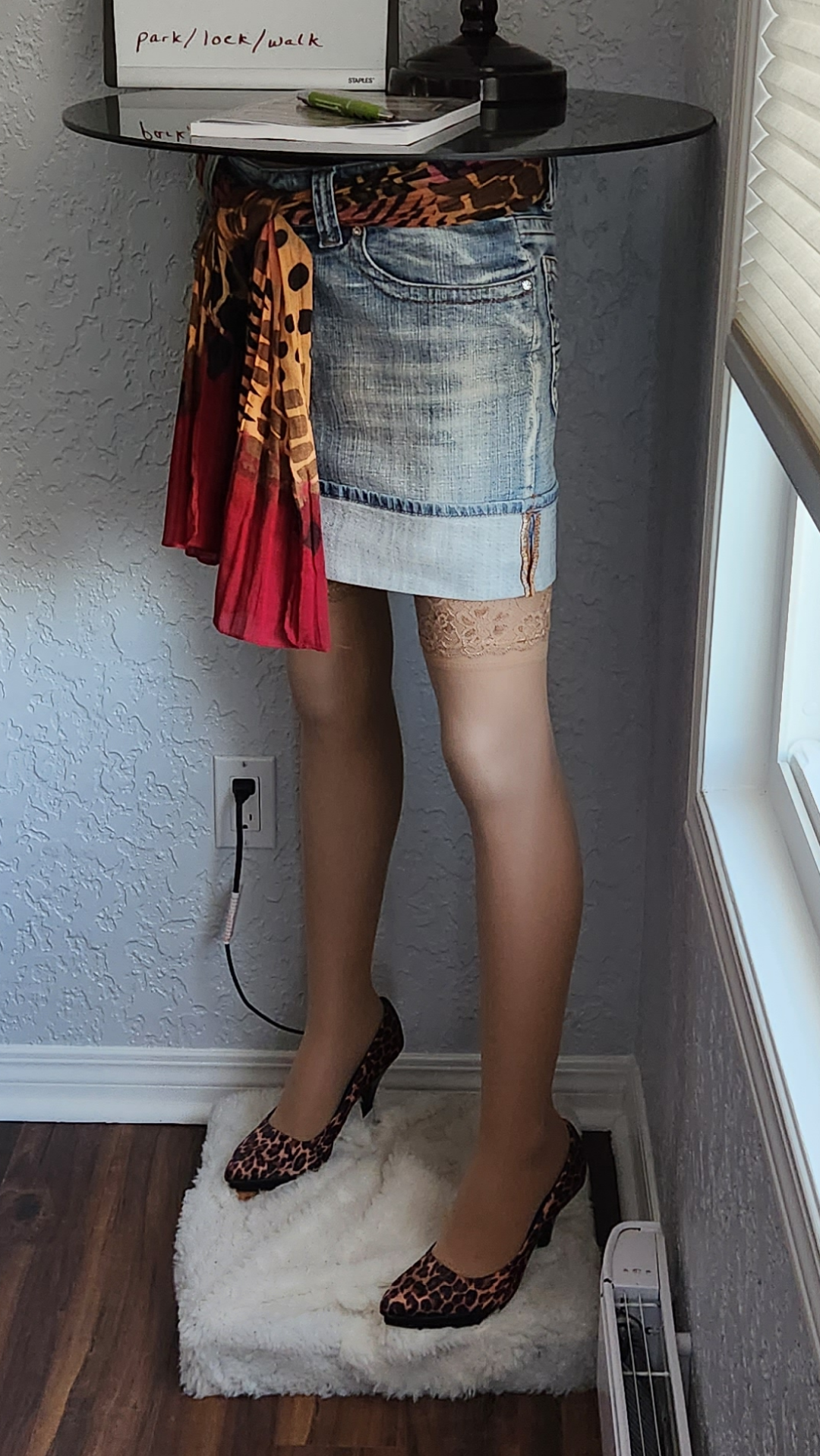 lamp stand is woman's legs with heels and shorts