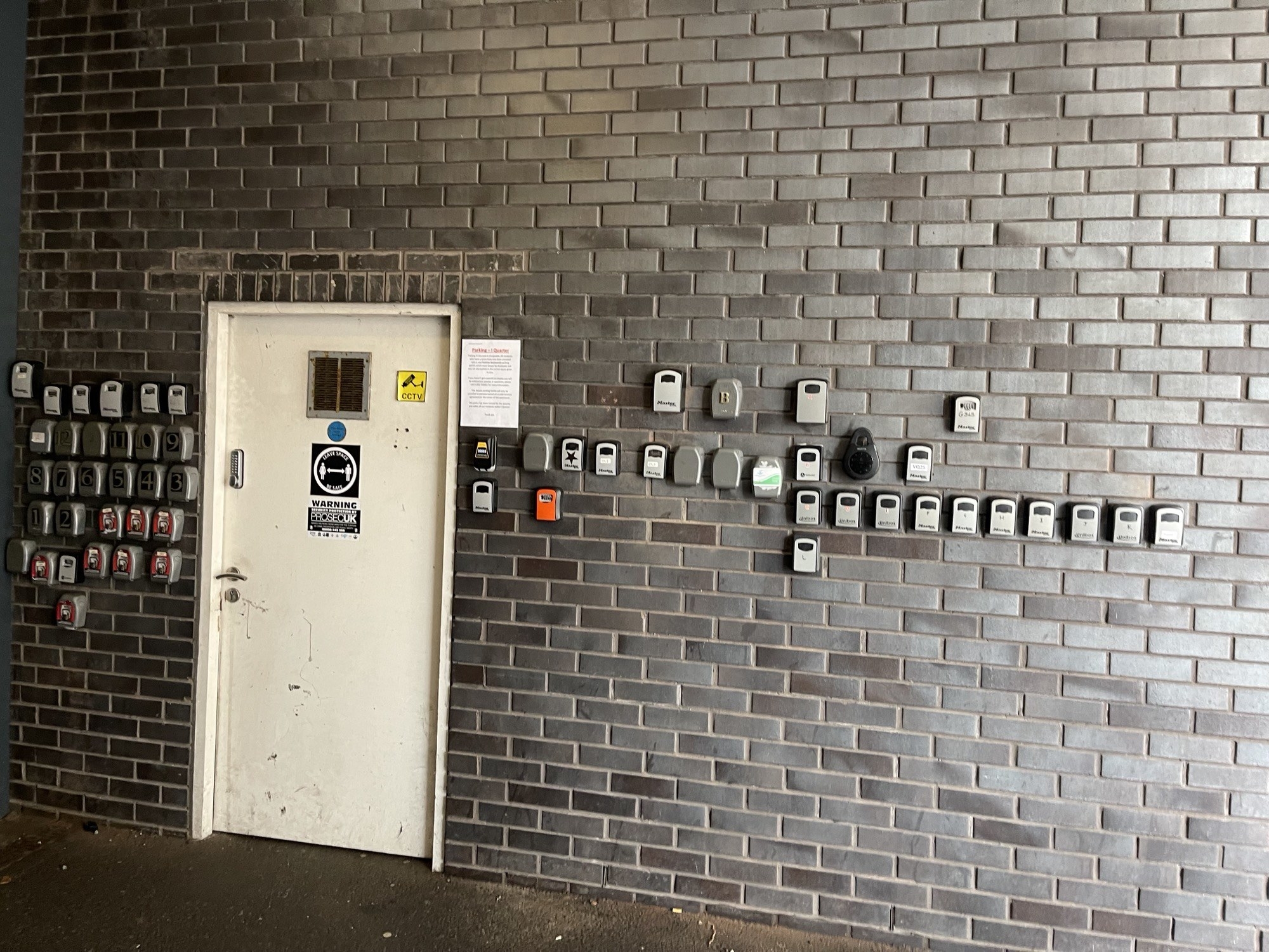 lots of padlocks surrounding the door