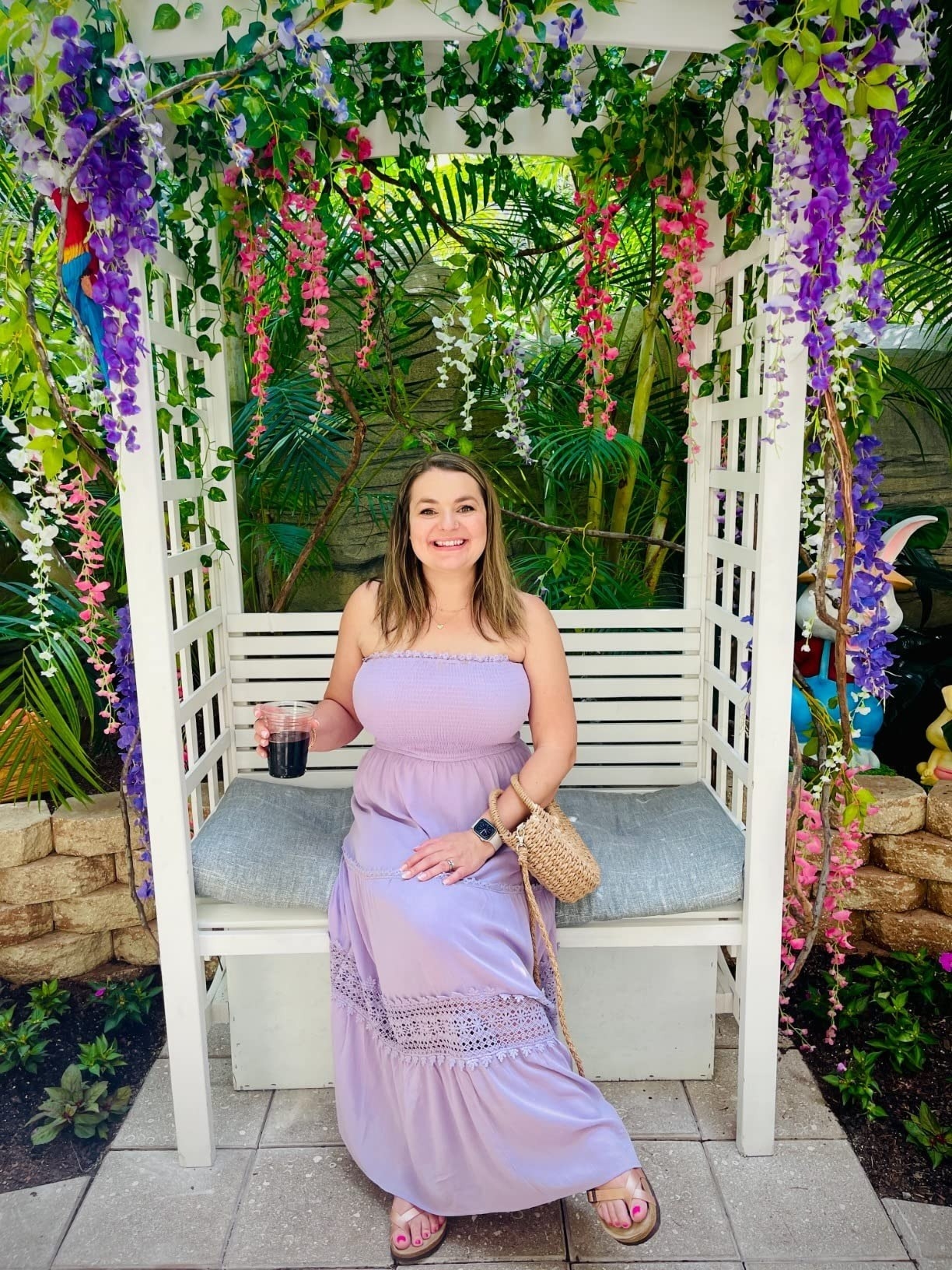 A reviewer in the lavender long dress