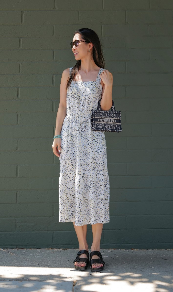 A reviewer in the white with black dots dress