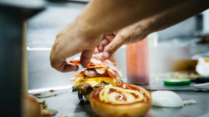 burger being prepped in fast food joint