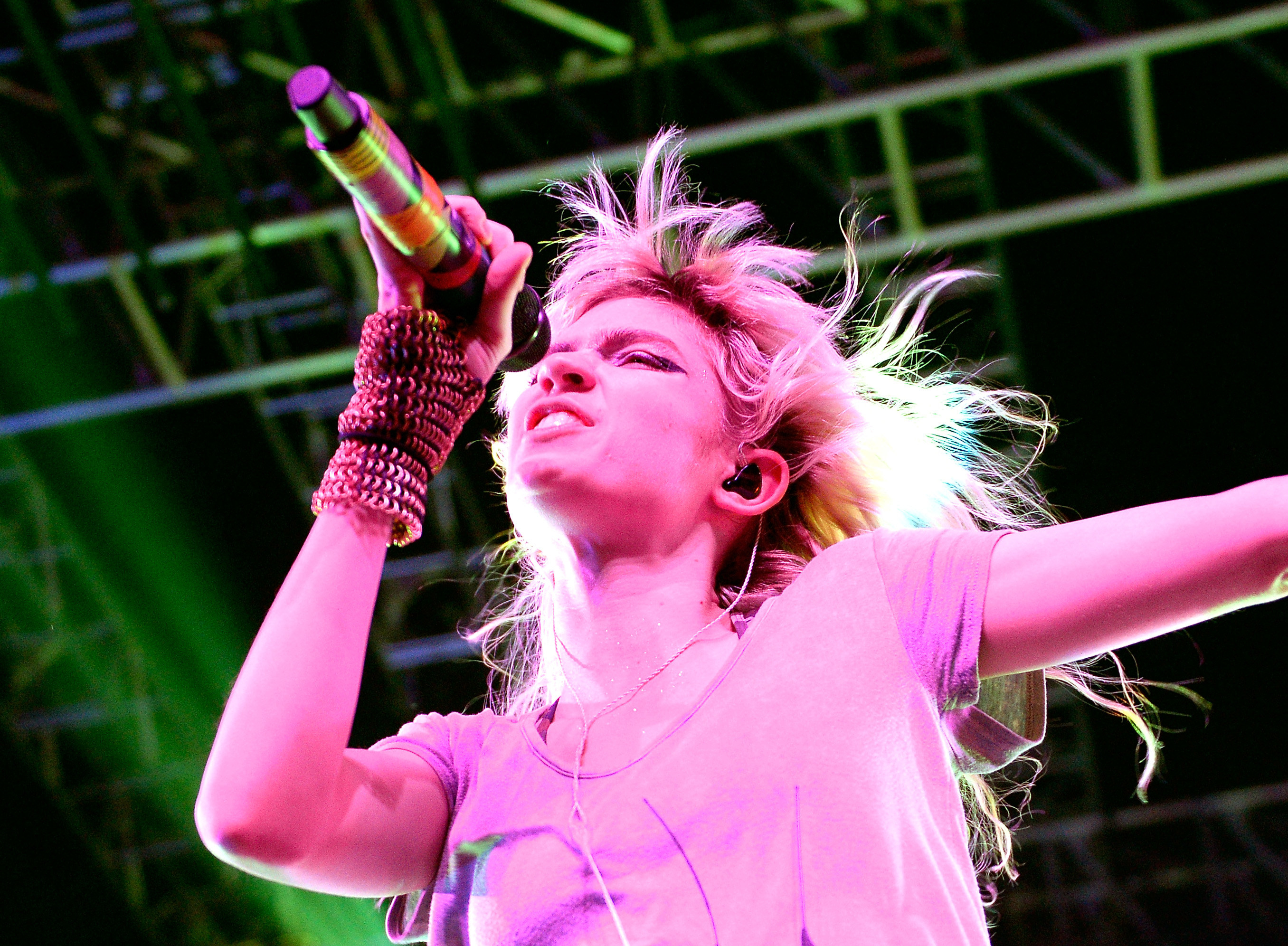 Grimes passionately performing onstage