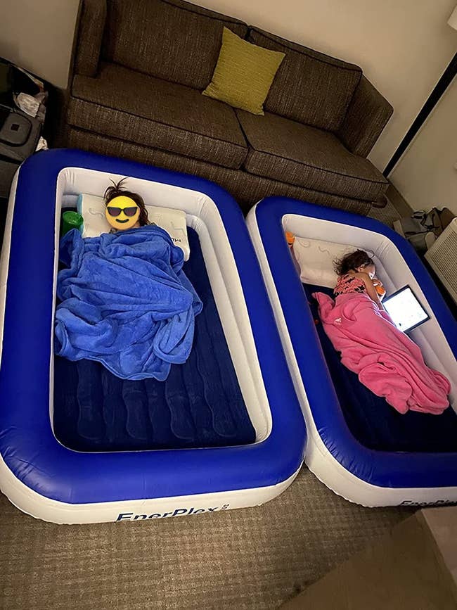 reviewer image of two toddlers each in their own inflatable bed
