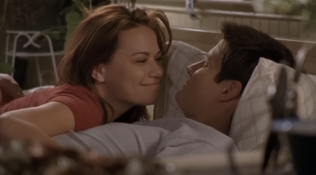 Nathan and Haley laying down and smiling at each other