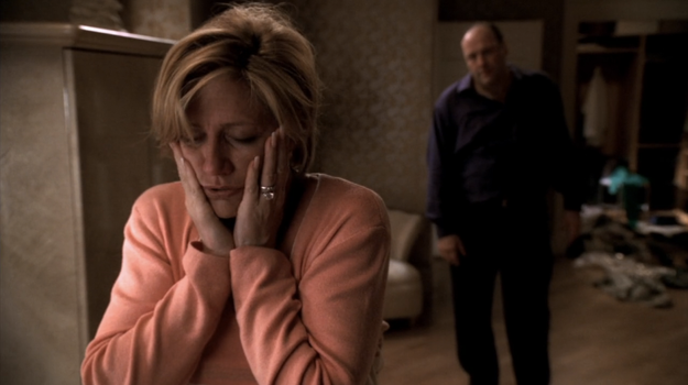 Carmela and Tony Soprano arguing while Carmela has her hands over her face