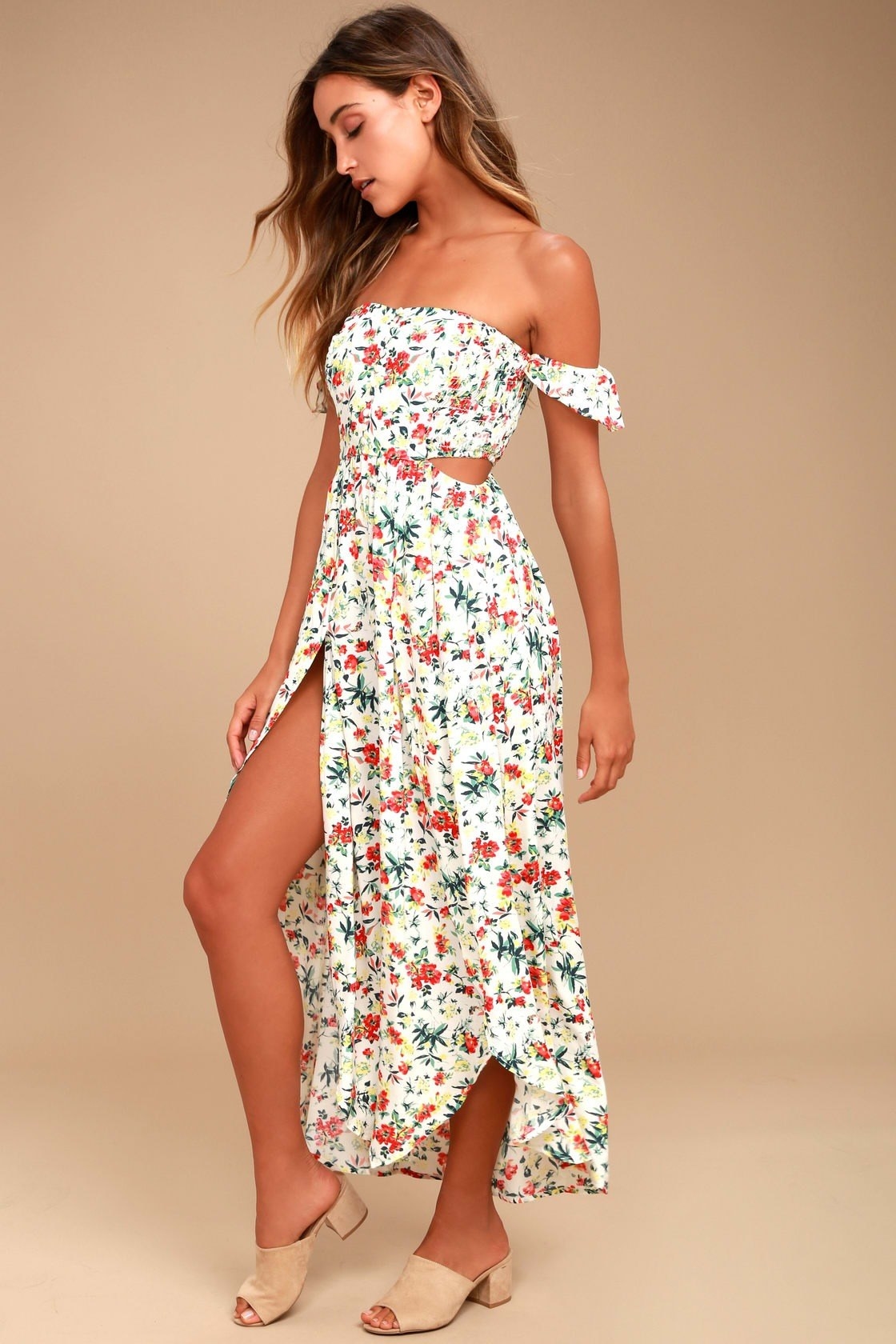 Model wearing white floral maxi cut-out dress