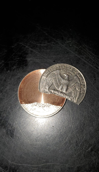 a broken quarter, with one side chipped off