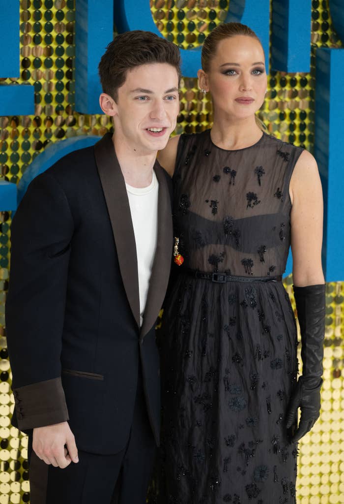 Jennifer Lawrence and Andrew Barth Feldman pose together for a photo on the red carpet